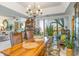 Bright dining room with stylish table, unique chairs, and plenty of natural light at 276 Salt Marsh Circle # 4D, Pawleys Island, SC 29585
