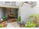 Charming front entrance featuring a covered porch and lush landscaping at 276 Salt Marsh Circle # 4D, Pawleys Island, SC 29585