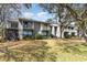 Townhouse complex with balconies and patios overlooking a grassy lawn at 276 Salt Marsh Circle # 4D, Pawleys Island, SC 29585