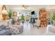 Bright living room with large windows, stylish furnishings, and modern decor at 276 Salt Marsh Circle # 4D, Pawleys Island, SC 29585