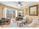 Bright living room with large windows and comfortable seating at 276 Salt Marsh Circle # 4D, Pawleys Island, SC 29585