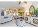 Open-concept living room and dining area with stylish furnishings and bright decor at 276 Salt Marsh Circle # 4D, Pawleys Island, SC 29585