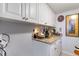 Pantry with white cabinets, granite countertops, and small appliances at 276 Salt Marsh Circle # 4D, Pawleys Island, SC 29585