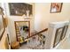 Elegant staircase featuring a large mirror, chandelier and beautiful wooden railings at 276 Salt Marsh Circle # 4D, Pawleys Island, SC 29585