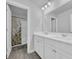 Bathroom featuring a double vanity, large mirror, and tub/shower combo with curtain at 2825 Stellar Loop, Myrtle Beach, SC 29577