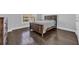 Bedroom showcases hardwood floors, a large window, and comfortable wood-frame bed at 2825 Stellar Loop, Myrtle Beach, SC 29577