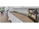 Granite countertop with white cabinets, and mug rack; great for prepping food or coffee at 2825 Stellar Loop, Myrtle Beach, SC 29577