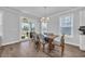 Dining area features a sliding glass door to a back patio and a modern chandelier at 2825 Stellar Loop, Myrtle Beach, SC 29577