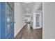 Bright foyer with tiled floors, a blue front door and views into the home's open-concept living spaces at 2825 Stellar Loop, Myrtle Beach, SC 29577