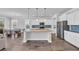 Beautiful kitchen with large granite island, modern lighting, and stainless steel appliances at 2825 Stellar Loop, Myrtle Beach, SC 29577