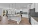 Bright kitchen features granite counters, island with pendant lighting, and stainless steel appliances at 2825 Stellar Loop, Myrtle Beach, SC 29577