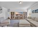 Open living space with hardwood floors, entertainment center, sectional sofa, and natural light at 2825 Stellar Loop, Myrtle Beach, SC 29577