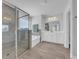 Bright main bathroom features a tiled shower, separate soaking tub, and double vanity at 2825 Stellar Loop, Myrtle Beach, SC 29577