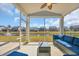 Relaxing screened porch with comfortable seating and tranquil pond views in a serene community at 2825 Stellar Loop, Myrtle Beach, SC 29577