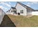 Spacious backyard with a well-maintained lawn and a view of the house, ideal for outdoor activities at 294 Portofino Dr., Myrtle Beach, SC 29579
