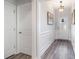 Bright entryway with light wood floors, white wainscoting, and an arched doorway at 294 Portofino Dr., Myrtle Beach, SC 29579