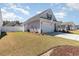 A charming home with a well-maintained lawn and fenced-in yard is shown in this image at 294 Portofino Dr., Myrtle Beach, SC 29579