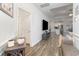 Spacious living area with wood flooring, modern decor, and an open concept kitchen at 294 Portofino Dr., Myrtle Beach, SC 29579