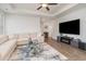 Inviting living room with a large sectional sofa, modern decor, and wood flooring at 294 Portofino Dr., Myrtle Beach, SC 29579