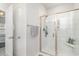 Modern shower with glass doors and white tiled walls, providing an open and clean feel at 294 Portofino Dr., Myrtle Beach, SC 29579