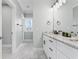 Bathroom featuring a modern vanity, marble countertops, sleek fixtures, and stylish tile flooring at 305 Lineback Pl. # 33, Longs, SC 29568