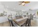 Spacious dining area with wood-look floors, stylish seating, and an open-concept flow into living areas at 305 Lineback Pl. # 33, Longs, SC 29568