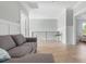 Upstairs bonus room with light-colored hardwood flooring and wainscoting at 305 Lineback Pl. # 33, Longs, SC 29568