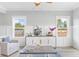 Bright living room with a decorative cabinet, comfortable seating, and large windows with scenic views at 305 Lineback Pl. # 33, Longs, SC 29568