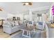 Open-concept living room with stylish furniture, wood-look floors, and ample natural light at 305 Lineback Pl. # 33, Longs, SC 29568