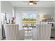Cozy living room featuring stylish striped chairs with views of the water at 305 Lineback Pl. # 33, Longs, SC 29568