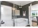 Modern bathroom featuring a shower, bathtub, and stylish vanity area at 324 Mayflower Dr., Calabash, NC 28467