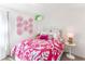 Charming bedroom with bright pink accents, stylish decor, and comfortable furnishings at 324 Mayflower Dr., Calabash, NC 28467