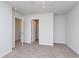 Bedroom with carpeted floors, neutral walls, and doorways to closet and other rooms at 324 Mayflower Dr., Calabash, NC 28467