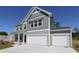 Charming two-story home with a two-car garage and well-manicured landscaping at 324 Mayflower Dr., Calabash, NC 28467