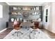 Stylish home office featuring a gray accent wall with floating shelves and a decorative clock at 324 Mayflower Dr., Calabash, NC 28467