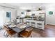 Bright kitchen with stainless steel appliances and a large dining table for entertaining at 324 Mayflower Dr., Calabash, NC 28467