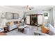 Cozy living room with a ceiling fan, stylish decor, and plenty of natural light at 324 Mayflower Dr., Calabash, NC 28467