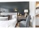 Close-up of the stylish desk, with decor and lighting, adjacent to the bed in this room at 324 Mayflower Dr., Calabash, NC 28467