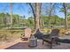 Peaceful backyard featuring outdoor seating, a fire pit, and serene landscaping at 356 Savannah Dr., Pawleys Island, SC 29585
