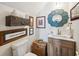 Unique powder room featuring stylish sink, vanity, fixtures and decorative accents at 356 Savannah Dr., Pawleys Island, SC 29585