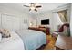 Bright bedroom with hardwood floors, a ceiling fan, a double bed, and plenty of closet space at 356 Savannah Dr., Pawleys Island, SC 29585