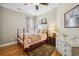 Charming bedroom featuring hardwood floors, floral bedding, and natural light at 356 Savannah Dr., Pawleys Island, SC 29585