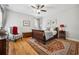 Cozy bedroom featuring hardwood floors, a comfortable bed, and natural light at 356 Savannah Dr., Pawleys Island, SC 29585