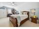 Cozy bedroom with a wooden bed frame, a desk with shelving, and lots of natural light at 356 Savannah Dr., Pawleys Island, SC 29585