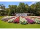 Lush landscaping and colorful flowers surround the entrance sign to Pawleys Plantation Golf and Country Club at 356 Savannah Dr., Pawleys Island, SC 29585