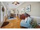 Sunlit dining area featuring hardwood floors, wainscoting, and a view of the adjacent living space at 356 Savannah Dr., Pawleys Island, SC 29585