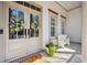 Inviting front entrance with double doors, decorative wreaths, and a cozy sitting area at 356 Savannah Dr., Pawleys Island, SC 29585