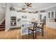 Bright eat-in kitchen with white cabinets, stainless steel appliances, and a large island with countertop seating at 356 Savannah Dr., Pawleys Island, SC 29585