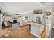 Spacious living room with an island, hardwood floors, fireplace, and abundant natural light at 356 Savannah Dr., Pawleys Island, SC 29585