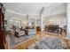 Elegant living room with hardwood floors, neutral paint, and stylish furniture arrangement, seamlessly flowing into the dining area at 356 Savannah Dr., Pawleys Island, SC 29585